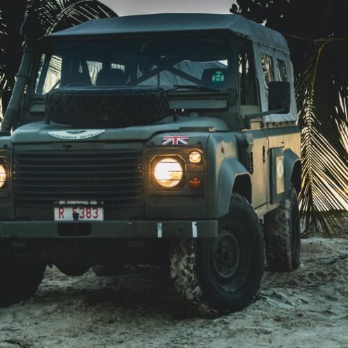 Children boarding a Land Rover Defender for an Antigua family island adventure